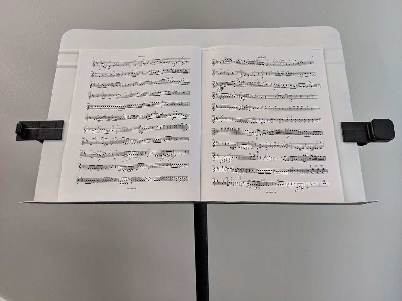 Wind Wynder clipped to a music stand with music pages open